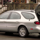 This Ford Taurus Badge says “24 DOHC”